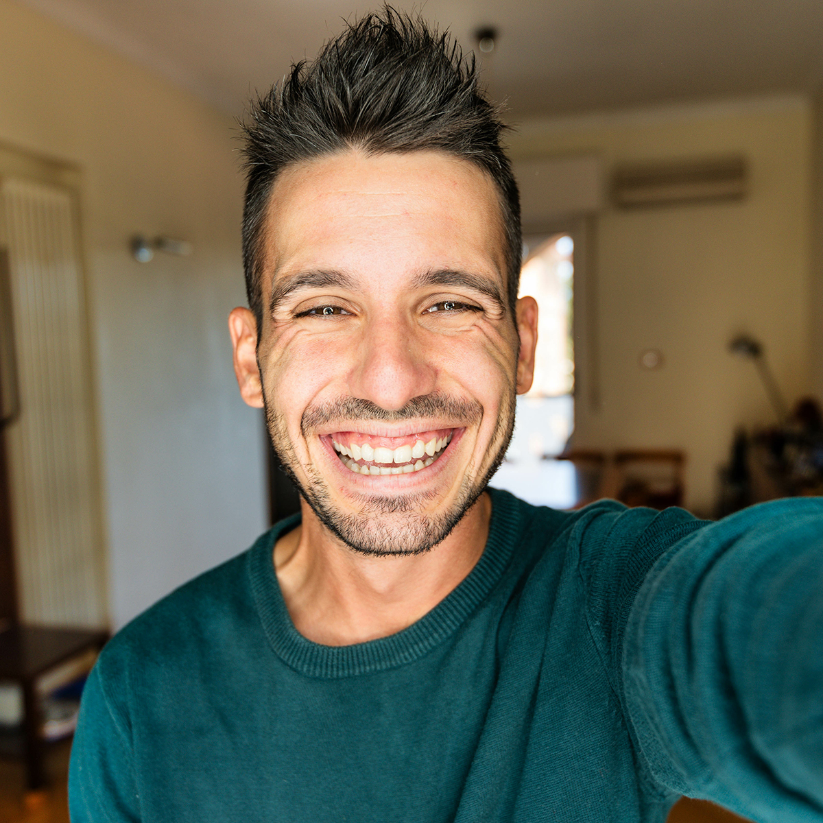 happy man taking selfie in home happy man taking selfie in home