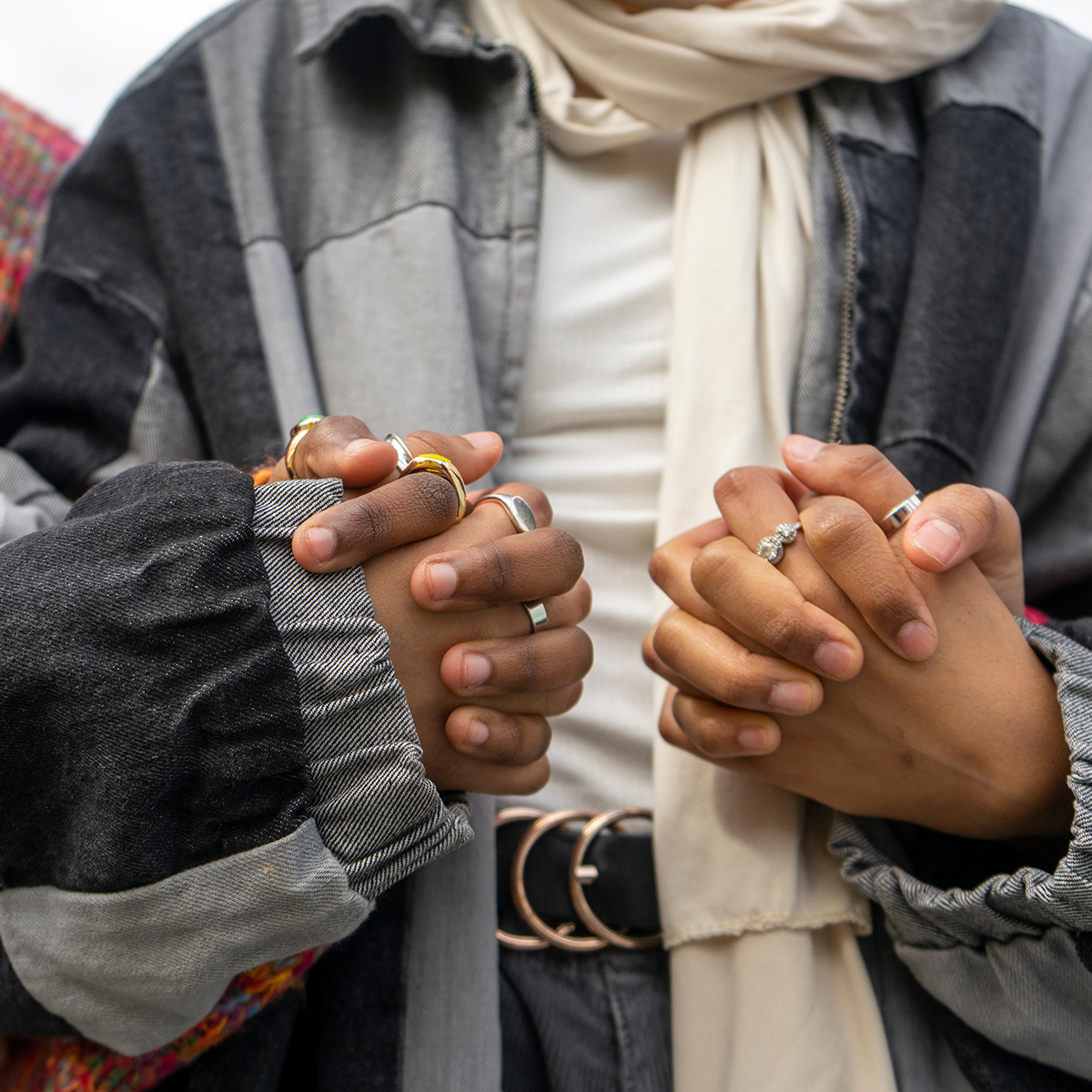 close up of women holding hands in support close up of women holding hands in support