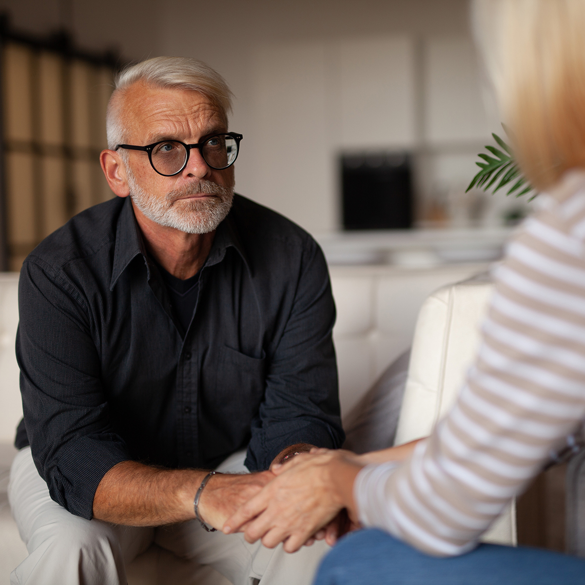 Senior counseling and support man with his therapist
