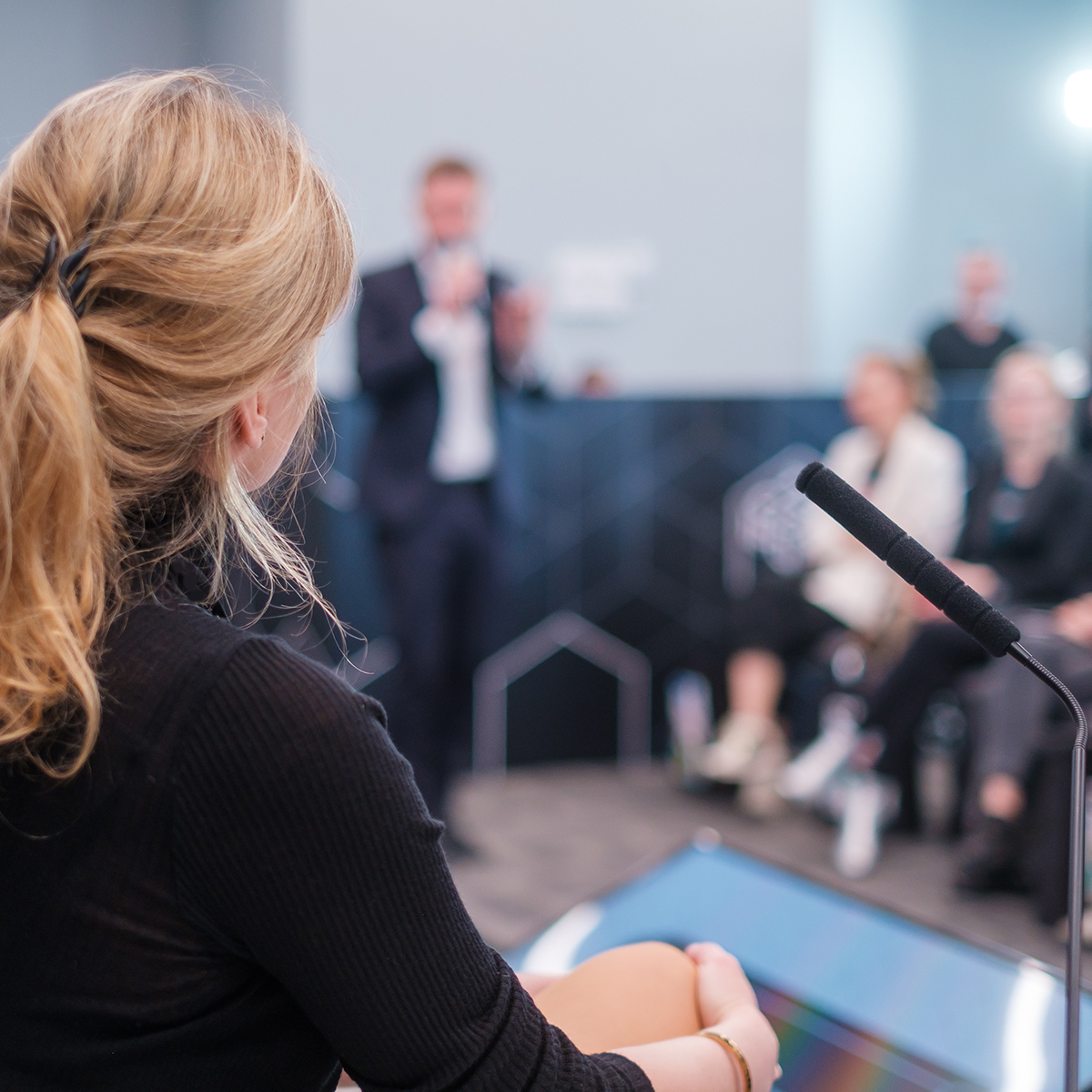 female speaker giving a presentation female speaker giving a presentation